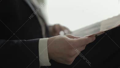 Businessman is reading a newspaper