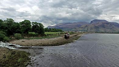 Flying over the abandoned ship wreck in Fort William twowards Ben Nevis