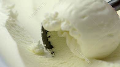 scooping vanilla ice cream close up
