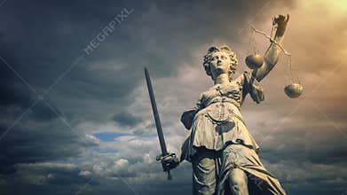 Justice statue in sun glow