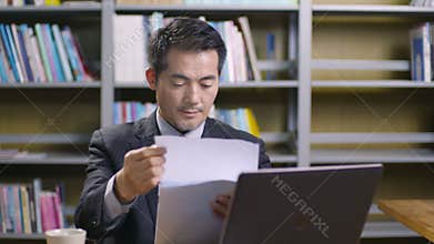 Asian corporate executive working in office