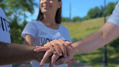 Overjoyed volunteers standing together in the park