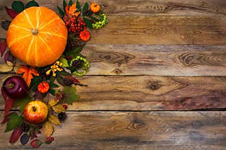 Happy Thanksgiving decor with fall leaves on wooden background