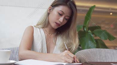 Asian female student learning english language