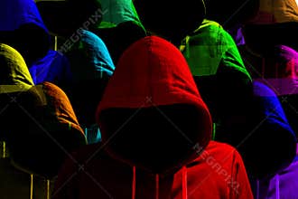 Group of differently colored hooded hackers cybersecurity concept