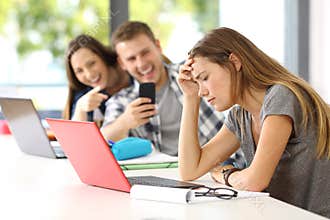 Sad student victim of cyber bullying