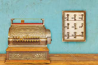 Cash register and cabinet with hotel keys and room numbers