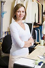 Woman at clothing store smiling