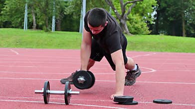 Teenager exercising with dumbbells