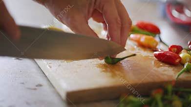 Chili peppers cut at chopping board - close up