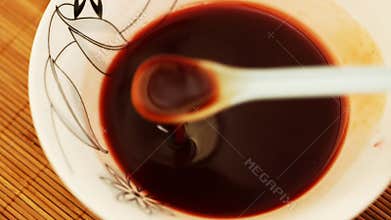 Making sweet vine sauce - closeup