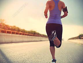 Runner athlete running on road