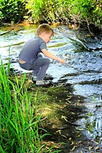 Boy by a Stream