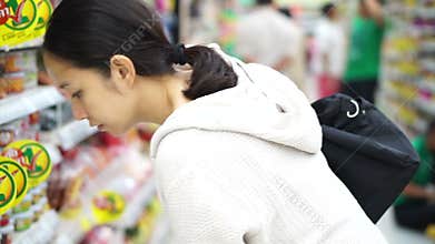 Asian girl, woman walking, looking and shopping in supermarket