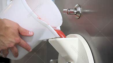 Prepare ice cream with professional machine, strawberry flavor