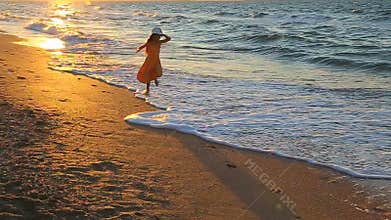 Child running along the surf