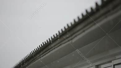 Rain and the roof of an apartment house