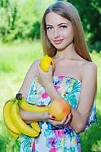 Happy girl and healthy vegetarian food, fruit