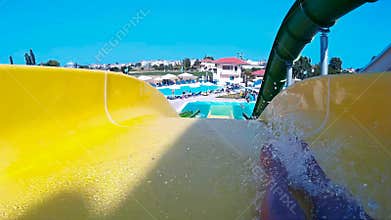Going down the water slide in aqua park