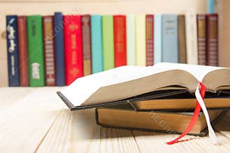 Open book, hardback books on wooden table. Back to school. Copy space