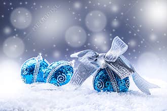 Christmas. Christmas blue balls and silver ribbon snow and space abstract background.
