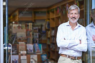Portrait Of Male Bookshop Owner Outside Store