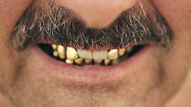 Portrait of an evil man with a mustache, with iron teeth