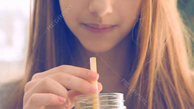 Girl drinking lemonade.