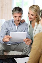 Couple meeting and discussing with financial advisor