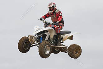 ATV Motocross Rider Over a jump