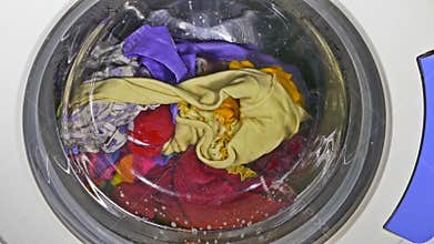 Washing clothes machine spinning wears underwear clothing