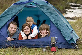Family camping in tent