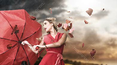 Glamour woman holding a broken umbrella in cinemagraph