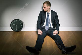 Concerned young man and passing time