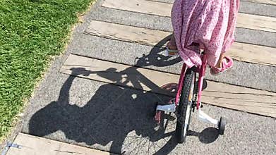 Girl ride a bicycle in the park