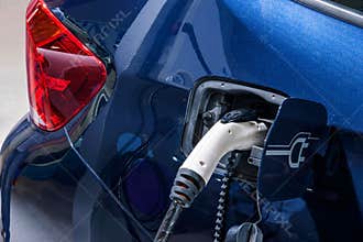 Electric vehicles and electric vehicle charging stations