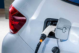 Electric vehicles and electric vehicle charging stations