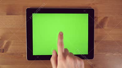 Man Using Tablet PC with Green Screen