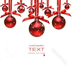 Red christmas balls with bows on white