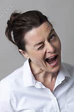 Cheeky 40s woman winking for fun and happiness