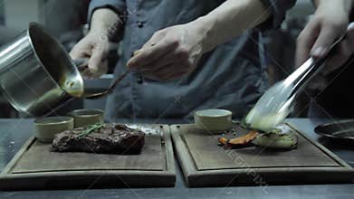 Chefs Prepare Steak and Grilled Vegetables for Visitors of the Restaurant