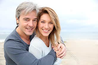 Cheerful mature couple on the beach