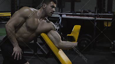 Bodybuilder exercising with weights
