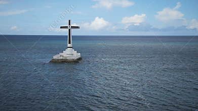 Catholic cross in the sea.