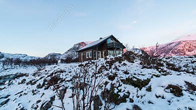 Cabin in front of frozen landscape in Norway