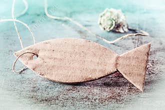 Empty brown Fish Tag on blue