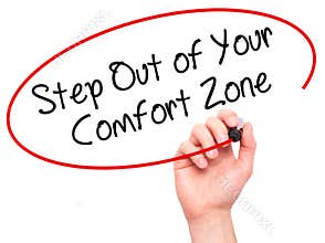 Man Hand writing Step Out of Your Comfort Zone with black marke