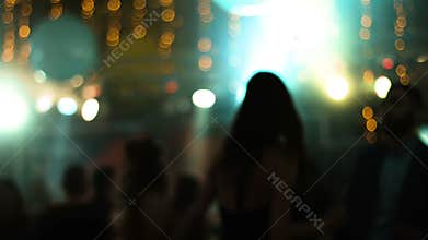 Blurred footage with young attractive people dancing in a nightclub.