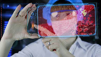 Doctor with futuristic hud screen tablet. Clogged Artery cholesterol plaque. Medical concept of the future