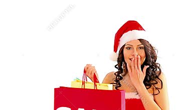 Woman in Santa hat holding shopping bag. Isolated.